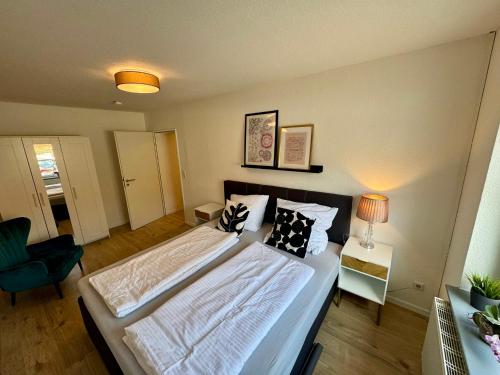 a bedroom with a large bed in a room at Schkeuditz Gästeapartment II in Schkeuditz