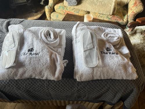 a pair of towels with the names of the towels at The Karal cabin in Canterbury