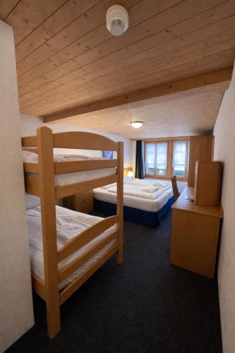 Chalet Rosa B&B tesisinde bir odada yatak veya yataklar