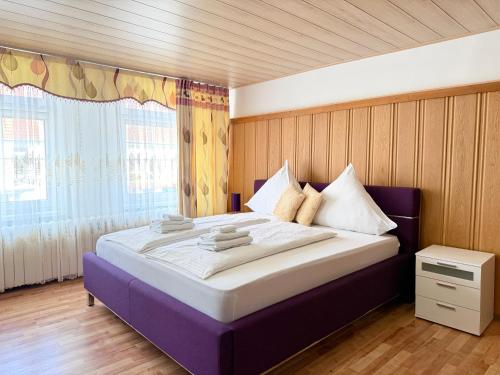 a bedroom with a large bed in a room at Asia Oase in Arendsee
