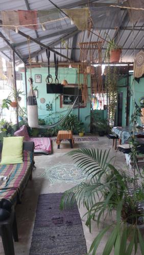a living room with couches and rugs at mountainview homestay in Jāmb