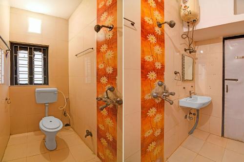 a bathroom with a toilet and a sink at FabHotel Step Inn Stays in Ballygunge