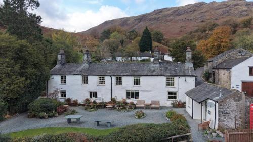 an aerial view of a house in the mountains at Seatoller House in Borrowdale