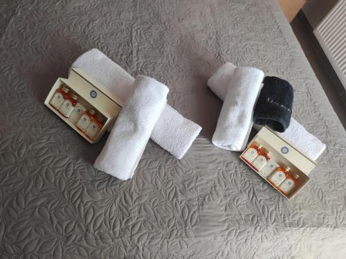 a couple of towels on top of a bed at Stefania's Luxury House in Platamonas