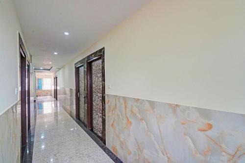 a hallway with a wall with fish painted on it at FabHotel Ultra Stay in Bhubaneshwar