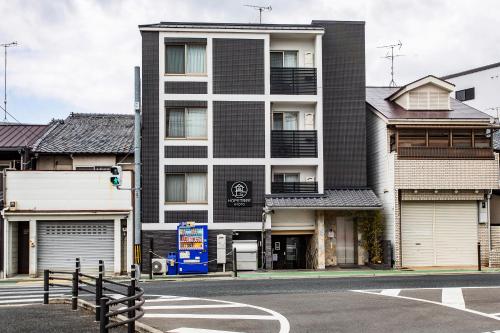 a building on the corner of a street at New open! Hopetree 京都 in Kyoto
