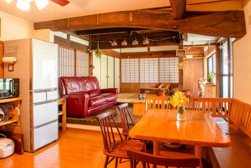 a kitchen and living room with a table and chairs at Mountain Home - One Hour From Osaka in Uda
