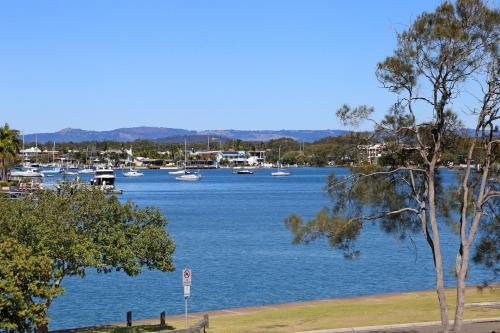 a large body of water with boats in it at Portsea in Mooloolaba