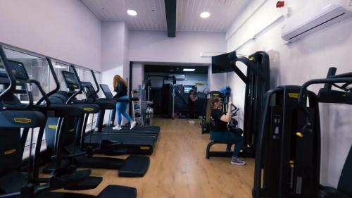 a group of people in a gym with machines at Avisford Park Hotel in Arundel