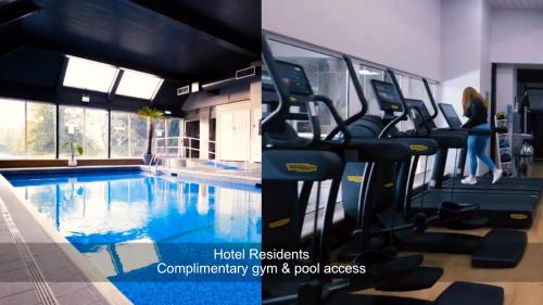 a gym with a swimming pool in a building at Avisford Park Hotel in Arundel