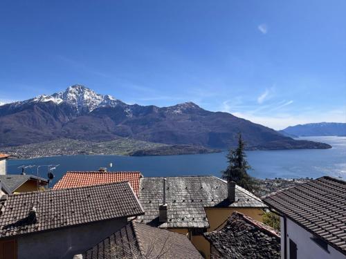 a view of a town with mountains and a lake at Rustico Maria Full House Lake View Escape in Vercana