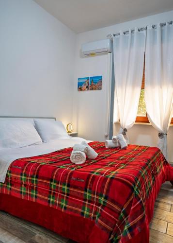 a bedroom with a bed with two towels on it at B&B dalla Nonna in Salerno
