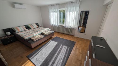 a living room with a bed and a window at Ferienhaus Kusel Blick in Kusel