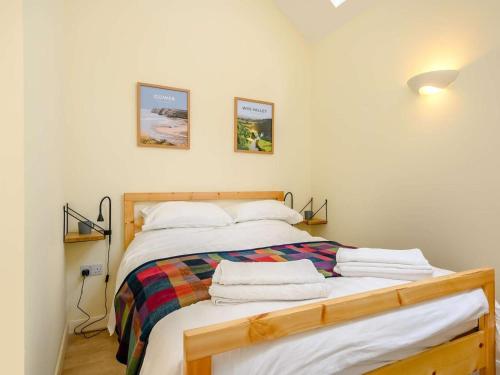 a bedroom with a bed with towels on it at 1 Bed in Clyro oc-86975 in Clyro