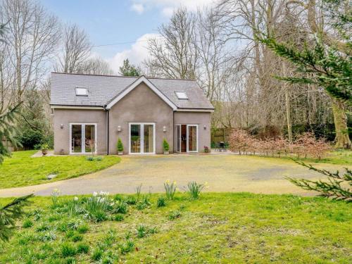 a house with a large driveway in a yard at 1 Bed in Ebbw Vale oc-58304 in Nantyglo