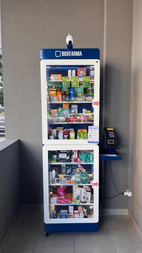 a refrigerator with its door open with food inside at Apartamento Giardino Maia, Café da Manhã cortesia em dias úteis in Guarulhos