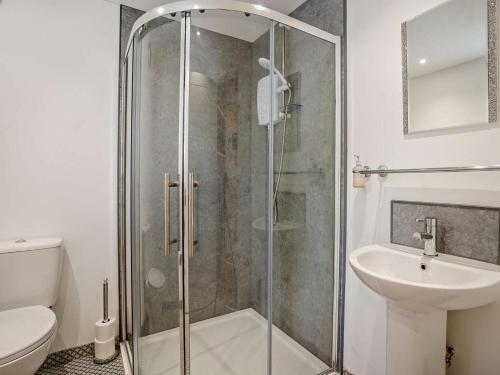 a bathroom with a shower and a toilet and a sink at 1 Bed in Pontypool oc-83405 in Mamhilad