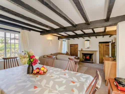 a dining room with a table and a fireplace at 3 Bed in Stratford-upon-avon oc-95736 in Stratford-upon-Avon