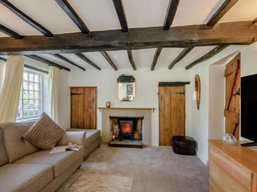 a living room with a couch and a fireplace at 3 Bed in Stratford-upon-avon oc-95736 in Stratford-upon-Avon