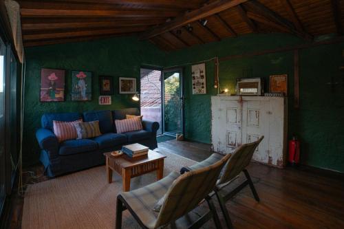 a living room with a couch and a table at Casa de Cabanelas in Bustelo
