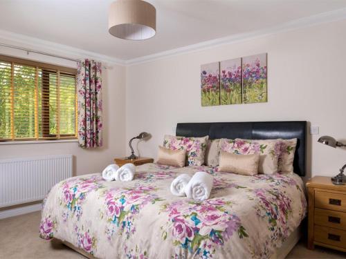 a bedroom with a bed with towels on it at 4 Bed in Ystradgynlais oc-bn343 in Ystalyfera