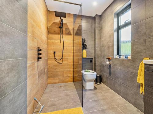 a bathroom with a shower and a toilet at 2 Bed in Knighton oc-94203 in Knighton
