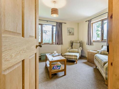 a living room with a couch and a chair at 2 Bed in Builth Wells oc-bn201 in Aberedw