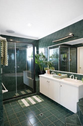 a bathroom with a sink and a glass shower at Infinity Views in Utakarra