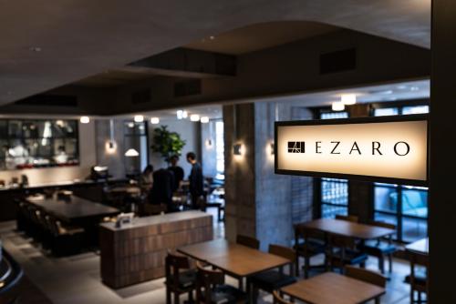 a restaurant with tables and a sign that reads the zarma at Tokyu Stay Shibuya Ebisu in Tokyo