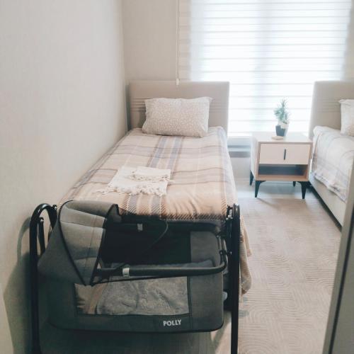 a small bedroom with a bed in a room at Ankara Esenboğa Airport Comfort Apart in Ankara