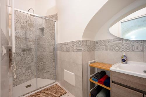 a bathroom with a shower and a sink at Petit Maison Martini ' in Altamura