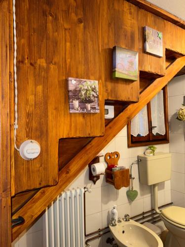 a bathroom with a toilet and a sink at Casa Angela-STAYERAT in Sequsino
