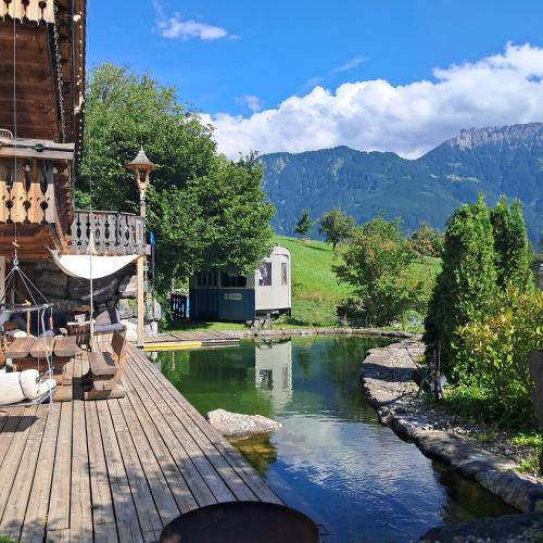 a view of a river from the deck of a house at Alpine Chalet L iechtenstein in Eschen