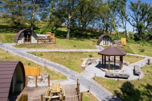 a model of a park with two huts and a playground at Pods @ Broadway in Laugharne