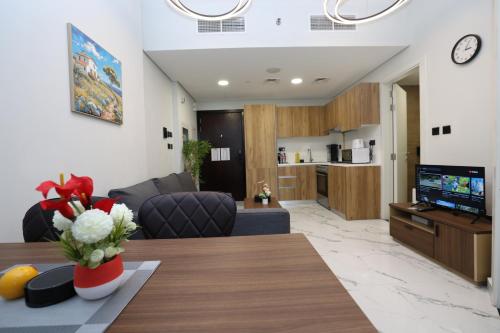 a living room with a couch and a table at 1 Bedroom in Maryah Island by Central Stay 1 min to Cleveland, Galleria Mall and ADGM in Abu Dhabi