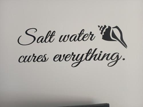a sign that reads salt water unless everything at Seashells-L10 in Dawlish Warren