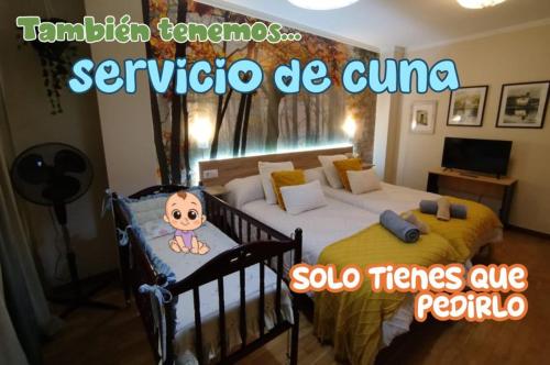 a bedroom with a bed with a baby doll on it at Domus Redes in Pola de Laviana