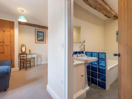 a bathroom with a sink and a bath tub at 8 Bed in Llanigon oc-bn241 in Llanigon