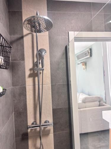 a shower with a shower head in a bathroom at ViLLA DANEIRA LUX in Mogán
