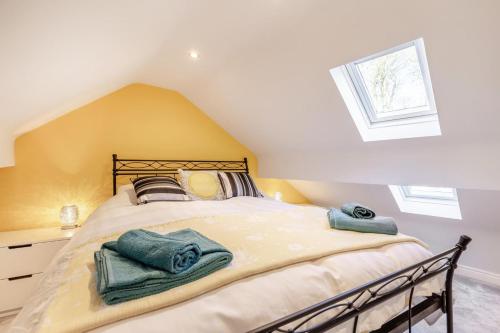 a bedroom with a bed with towels on it at 3 Bed in Tideswell oc-w39004 in Tideswell