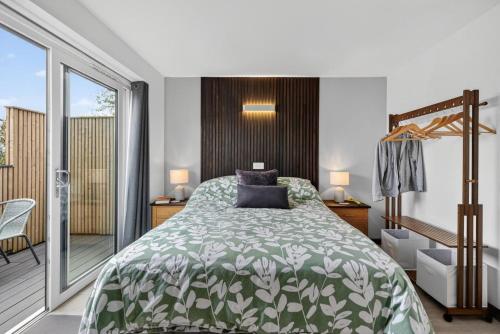 a bedroom with a bed and a balcony at 1 Bed in Minsterley oc-s38642 in Minsterley