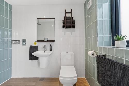 a bathroom with a toilet and a sink at 1 Bed in Minsterley oc-s38642 in Minsterley