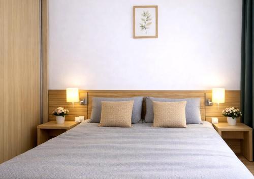 a bedroom with a large bed with two night stands at RNR Airport 3 in Otopeni