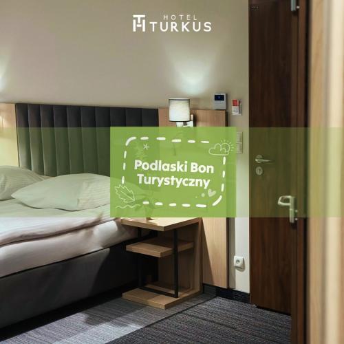 Llit o llits en una habitació de Hotel Turkus