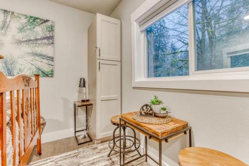 a room with a table and a window at Inviting studio with kitchenette & scenic forest setting in Welches