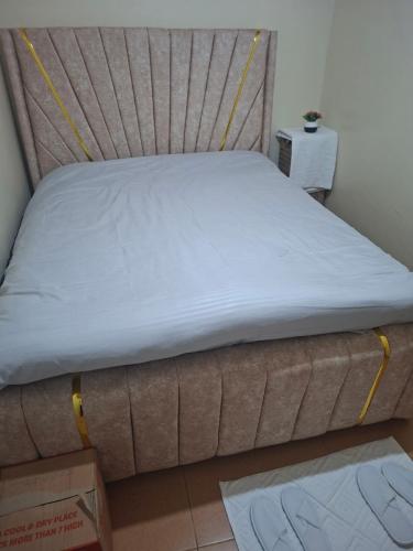 a bed sitting in a room with a box at Larmar Homes- Kajiado in Kajiado