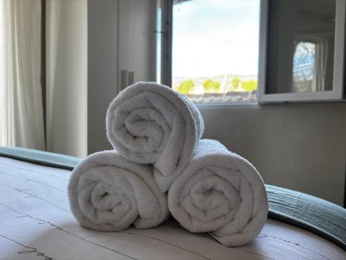 a pile of towels sitting on top of a table at Finca Avellaneda in Navahonda