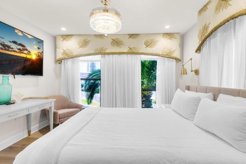 a bedroom with a large white bed and a window at Buena Vida 22 - A in Navarre