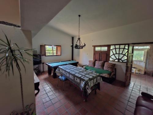 a living room with a ping pong table in it at Casa en El Rodeo in El Rodeo
