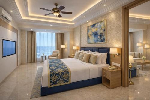 a bedroom with a large bed with a ceiling fan at Hotel CIELO PRIME Near Delhi Airport in New Delhi
